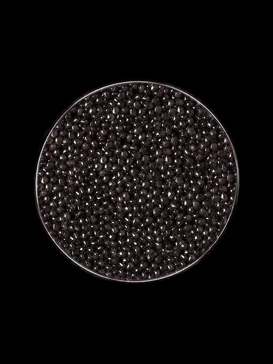 Boîte de caviar Baeri Impérial ouvert sur fond naturel