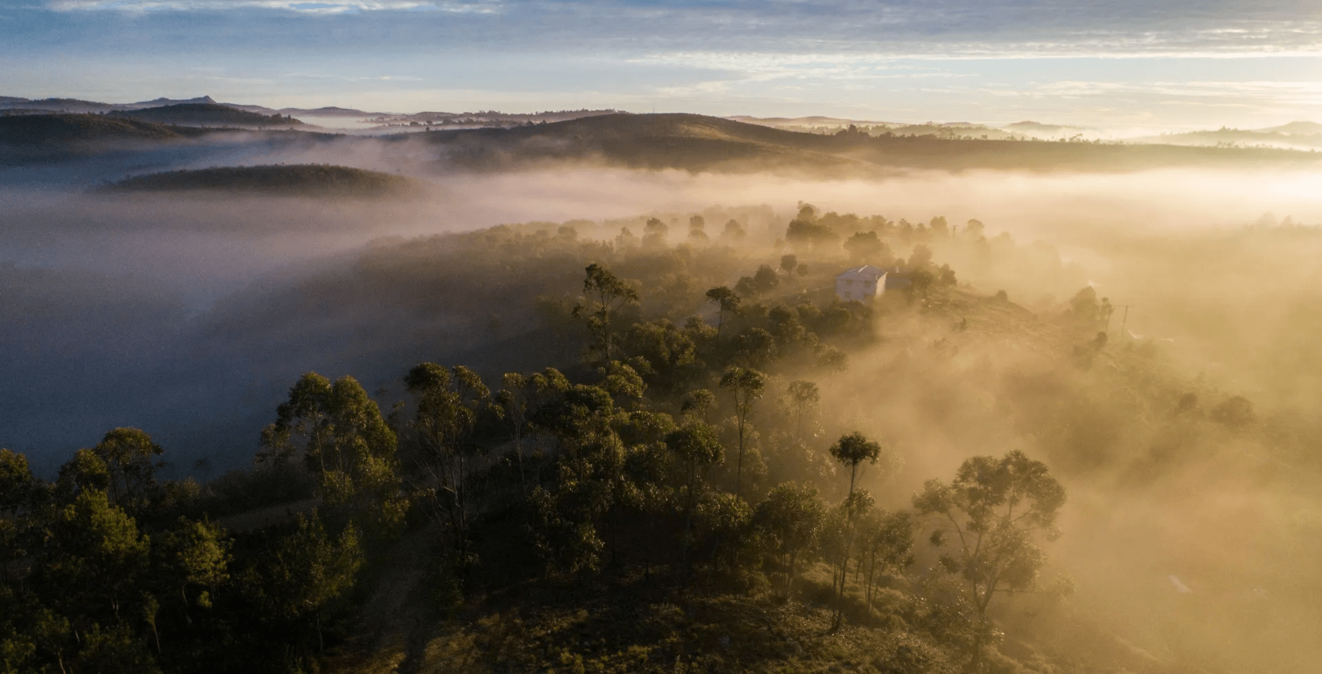 Mountainous Landscape from Drone with House and Light Mist