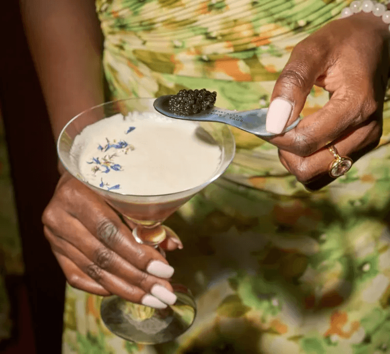 Close-up of a tasting with caviar spoon and cocktail