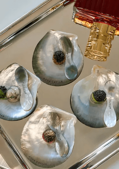 Service of 4 caviar bites on silverware tray