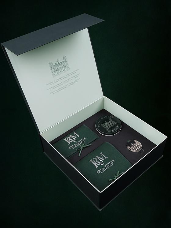 Open box with caviar accessory pouches